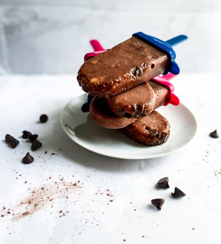 chocolate popsicles on a white plate